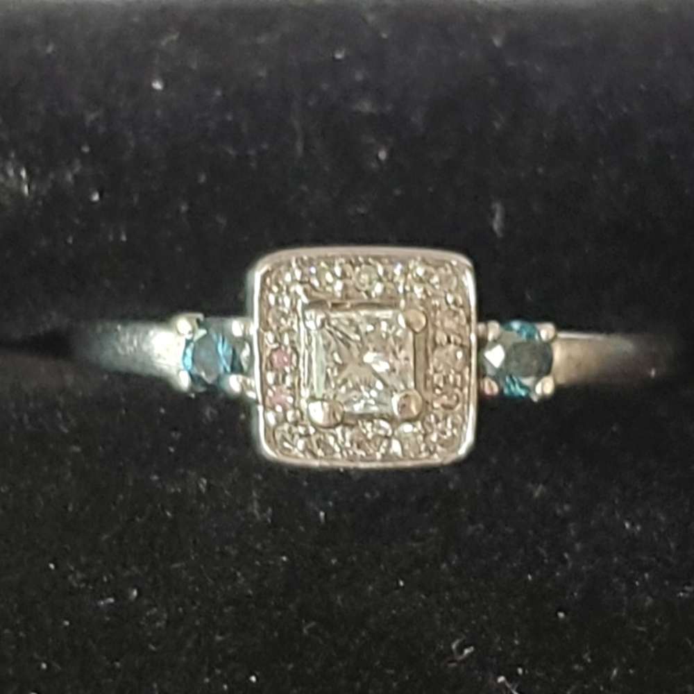 Diamond ring with blue diamond accents